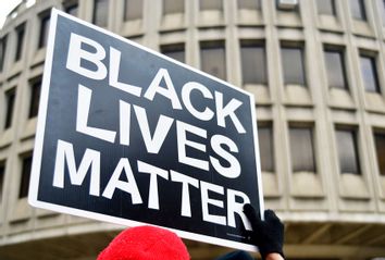 Black Lives Matter sign is held by a protestor