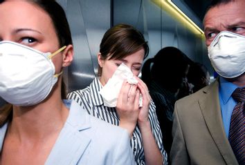 People in a lift during a health alert