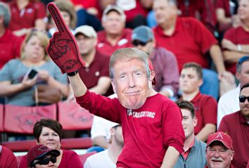 An Arizona Razorbacks fan in a Trump mask