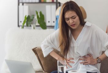 Young Woman With Stomach Pain