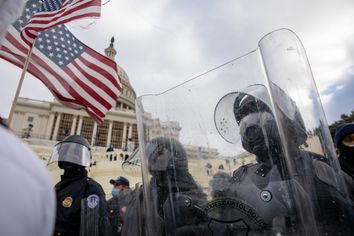 Pro-Trump protestors clash with police during the tally of electoral votes that that would certify Joe Biden as the winner of the U.S. presidential election outside the US Capitol in Washington, DC on Wednesday, January 6, 2021. 