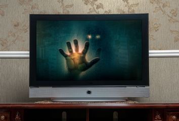 TV screen with spooky figure in the monitor