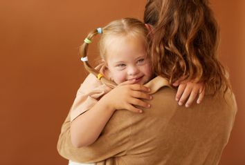 Mother Holding Autistic Daughter