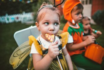 Eating candy in our backyard after the Halloween