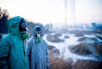 A portrait of people in gas masks in bad ecology