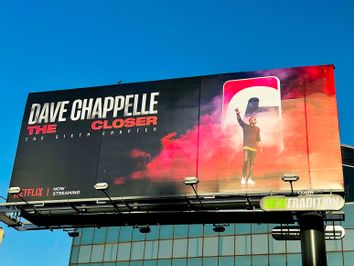 A Netflix billboard above Hollywood Blvd promoting Dave Chappelle's controversial comedy special 