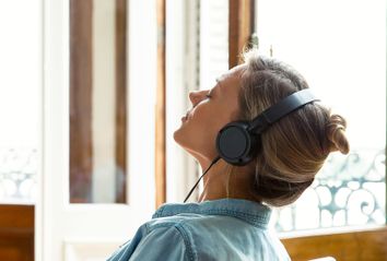 Woman relaxing while listening to music