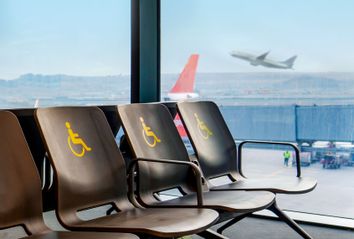 Empty disabled seats at an airport in the waiting area before boarding