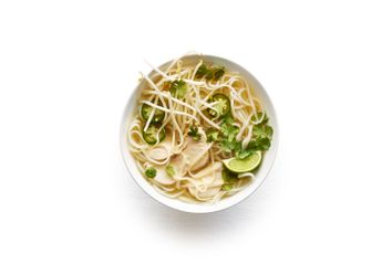 Chicken pho in white bowl