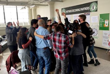 Starbucks employees celebrate after unionization votes are counted on December 9, 2021 in Buffalo, New York