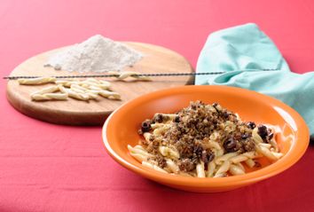 Homemade Maccheroncini pasta with crusty bread