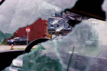 Bullet holes are seen in a van parked outside an Airbnb apartment rental along Suismon Street on April 17, 2022 in Pittsburgh, Pennsylvania