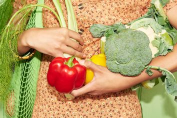 Woman holding vegetables