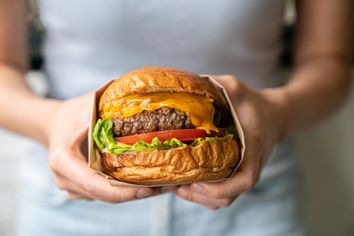 Woman holding a burger