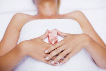 Woman laying with crystal