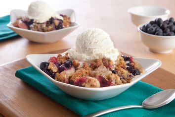 blueberry cobblers with ice cream and extra blueberries