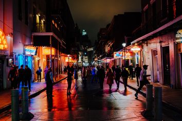 People On Illuminated City At Night, New Orleans, USA
