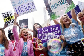 Anti-abortion campaigners celebrate outside the US Supreme Court in Washington