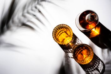 American bourbon whiskey in glasses and bottle