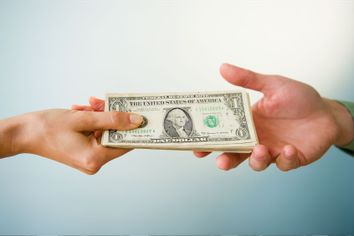 Hands holding banknotes