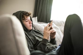 Teenage boy using smartphone