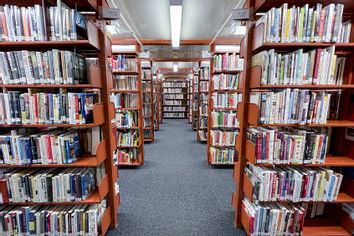 Books on shelves in the stacks at the Reading Public Library.