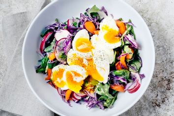 Fresh salad with soft boiled eggs