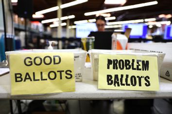 An election worker processes vote-by-mail ballots at the Orange County Registrar of Voters less than two weeks before midterms Election Day