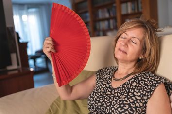 Woman fanning herself