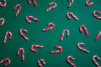 Candy Canes On Green Background