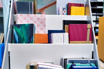 Annual planner notebooks on a shelf at a bookstore