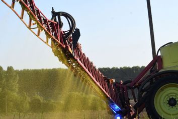 Spraying Roundup 720 glyphosate herbicide