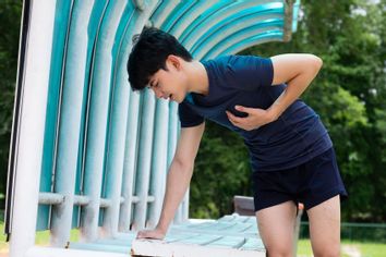 Young man suffering heart attack