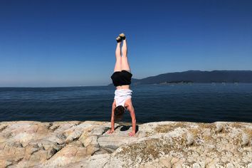 Author Cole Wolf doing a handstand