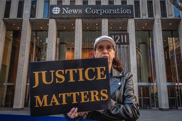 Participant seen holding a sign at the protest