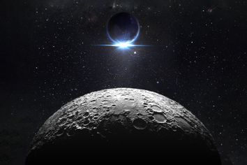 Moon surface with view sunrise of the earth