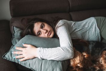 Sad woman on the couch