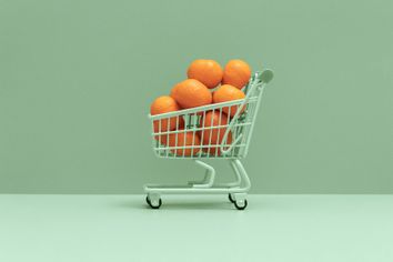 Shopping cart full of oranges