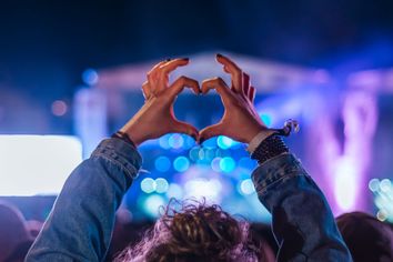 Woman making heart shape with hands