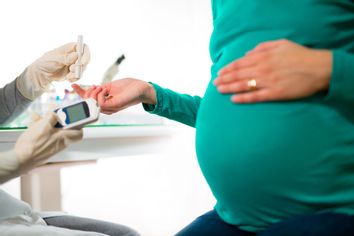 Pregnant Woman Having Blood Glucose Checked