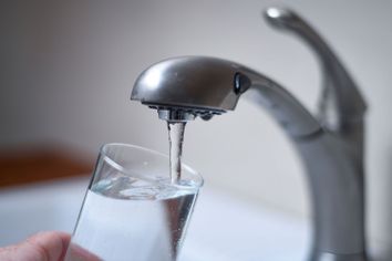 faucet tap water pouring in glass