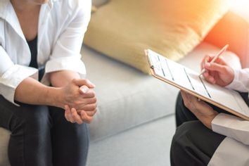 Woman consulting with psychologist