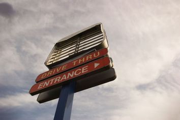 Sign at an abandoned fast food restaurant