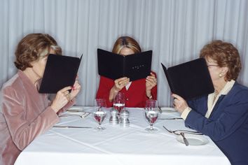 Women looking at the menu in restaurant