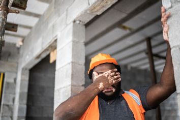 Exhausted construction worker