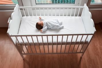 Baby sleeping in their crib