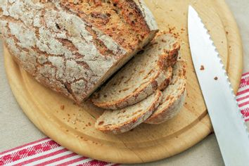 Sliced onion bread on a wooden board