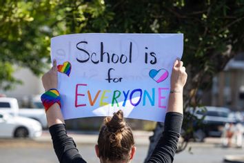 pro-LGBTQ+ demonstrator holds a sign