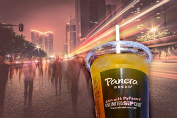 Panera Bread mango yuzu citrus charged lemonade | Blur people and traffic on a street at night