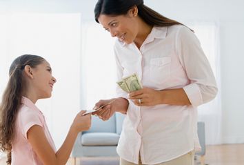 Mom giving daughter money